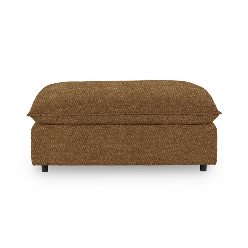 Classic Home Caplan upholstered ottoman with a cushioned top and wooden legs, ideal for living room or bedroom decor.