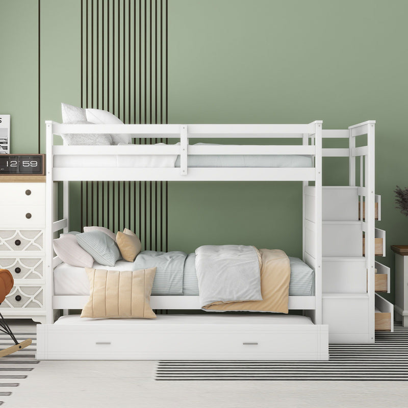 White DreamHaus twin over twin bunk bed with staircase and trundle, showcasing the sturdy frame and space-saving design.