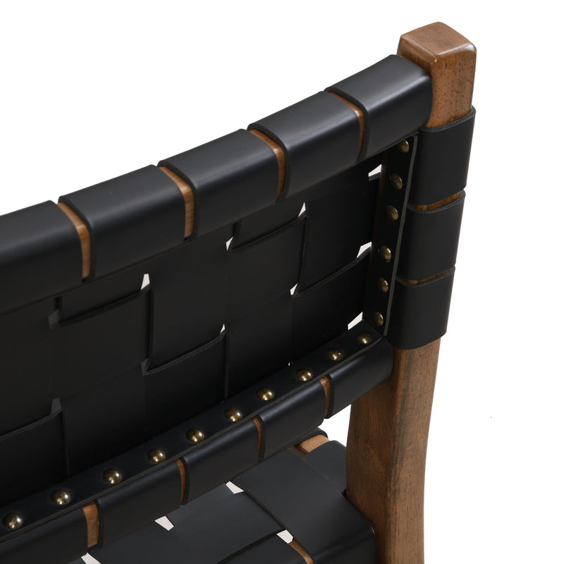 Modern style Noble House side dining chair with upholstered seat and sleek wooden frame, shown from a side angle.