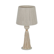 TOV Furniture Samba table lamp with a modern design, featuring a sleek base and a fabric lampshade on a wooden table.