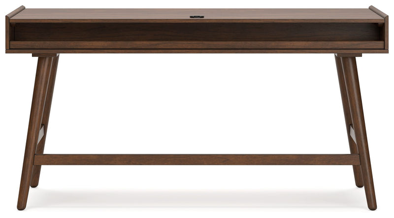 Signature Design by Ashley home office writing desk with a spacious tabletop and modern wood finish for workspace organization.