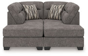 Benchcraft Olten stationary sectional sofa with plush cushions and neutral fabric, shown in a modern living room setting.