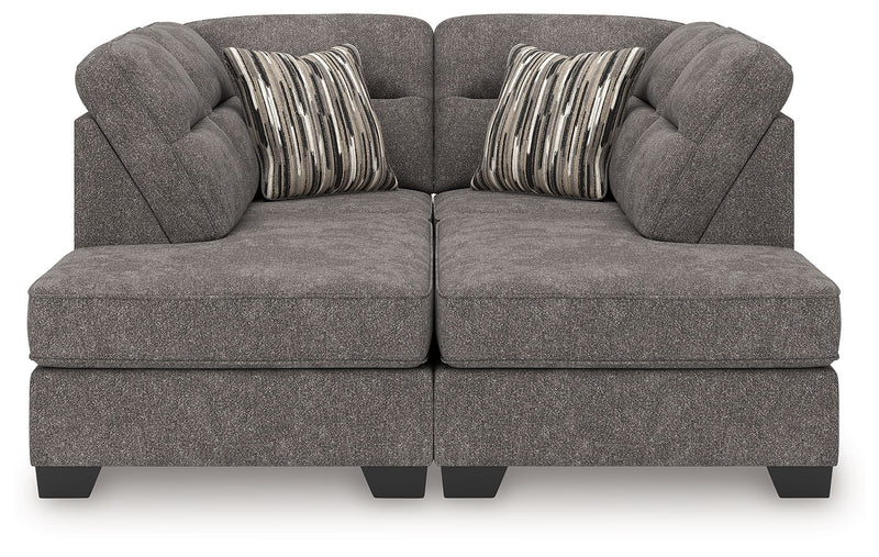 Benchcraft Olten stationary sectional sofa with plush cushions and neutral fabric, shown in a modern living room setting.