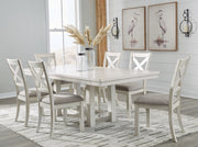 Signature Design by Ashley Robbinsdale 7-piece rectangular dining table set, including extension table and matching chairs.
