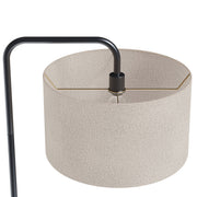 Lumi Source Puck contemporary floor lamp with a sleek round design, standing on a slim base in a modern living room.