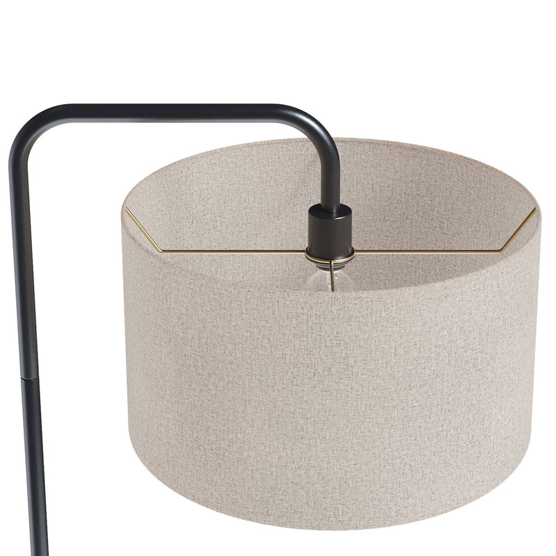 Lumi Source Puck contemporary floor lamp with a sleek round design, standing on a slim base in a modern living room.