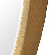 Uttermost Cabell wall mirror with a sleek, modern frame, hanging on a wall, reflecting a bright, stylish interior.