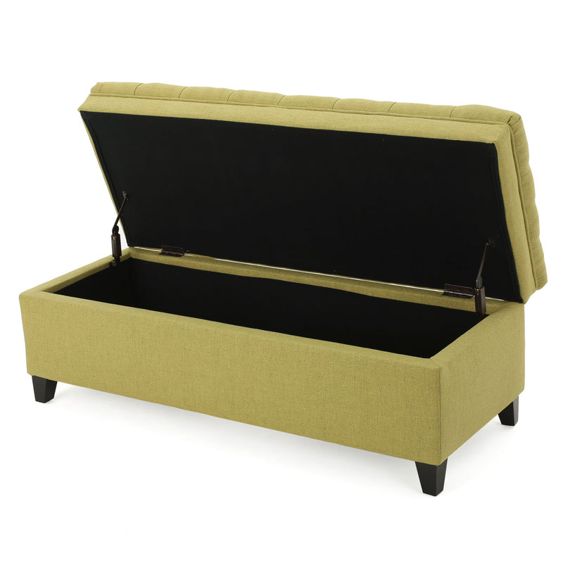 Noble House Juliana storage ottoman with birch wood legs, upholstered in neutral fabric, serving as versatile living room furniture