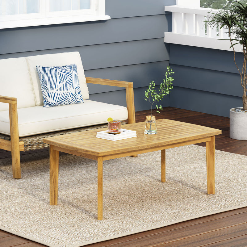 Brown outdoor rectangular coffee table by Noble House featuring a sturdy wooden design for patio or garden use.
