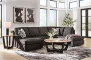 Signature Design by Ashley Lentiz stationary sectional sofa with plush cushions and neutral fabric in a modern living room setting.