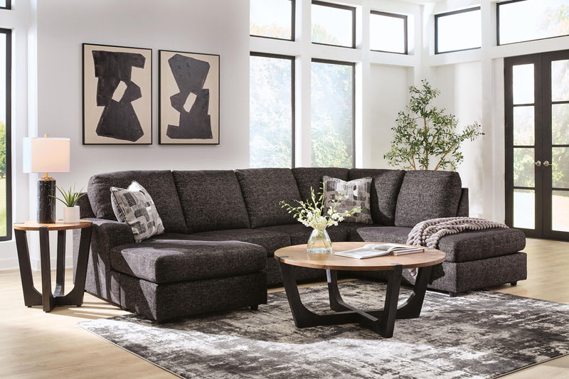 Signature Design by Ashley Lentiz stationary sectional sofa with plush cushions and neutral fabric in a modern living room setting.