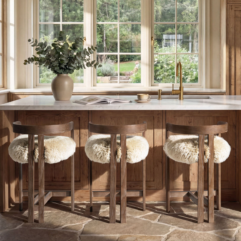 Jennifer Taylor Home Millwick low back counter stool with wooden legs and upholstered seat, suitable for kitchen or bar area.