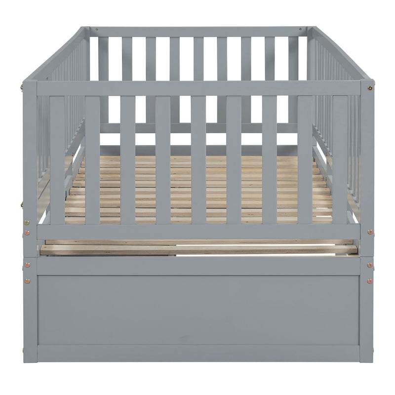 DreamHaus storage daybed with fence guardrails, two drawers, convertible into a floor bed and daybed, in a modern bedroom setting.