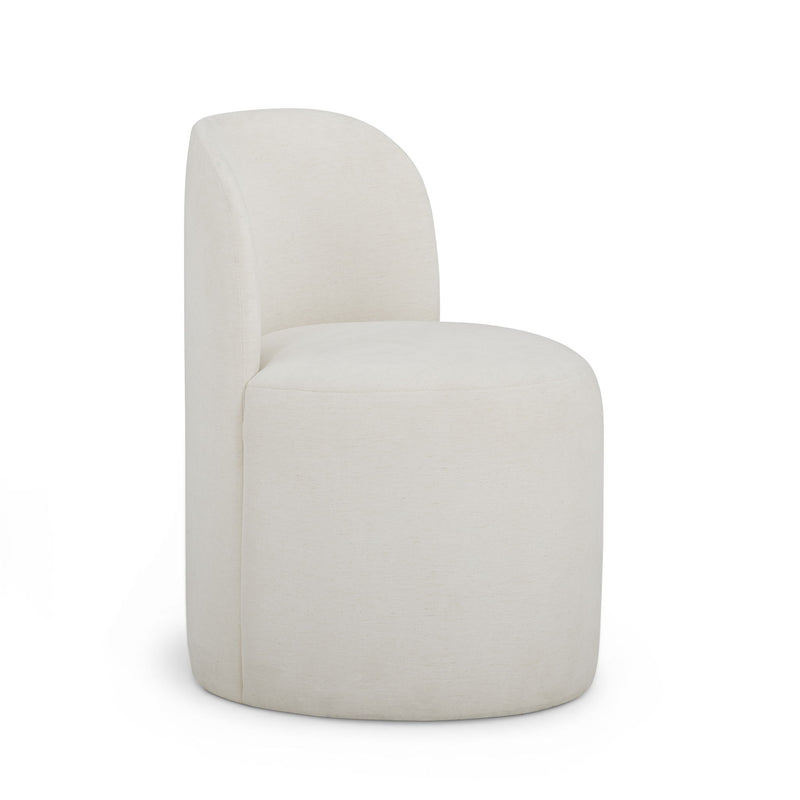 TOV Furniture Persa dining side chair with a sleek design, featuring a cushioned seat and modern wooden legs.