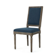 Noble House traditional style dining chair set with fabric upholstery, featuring elegant wooden frames and cushioned seats.