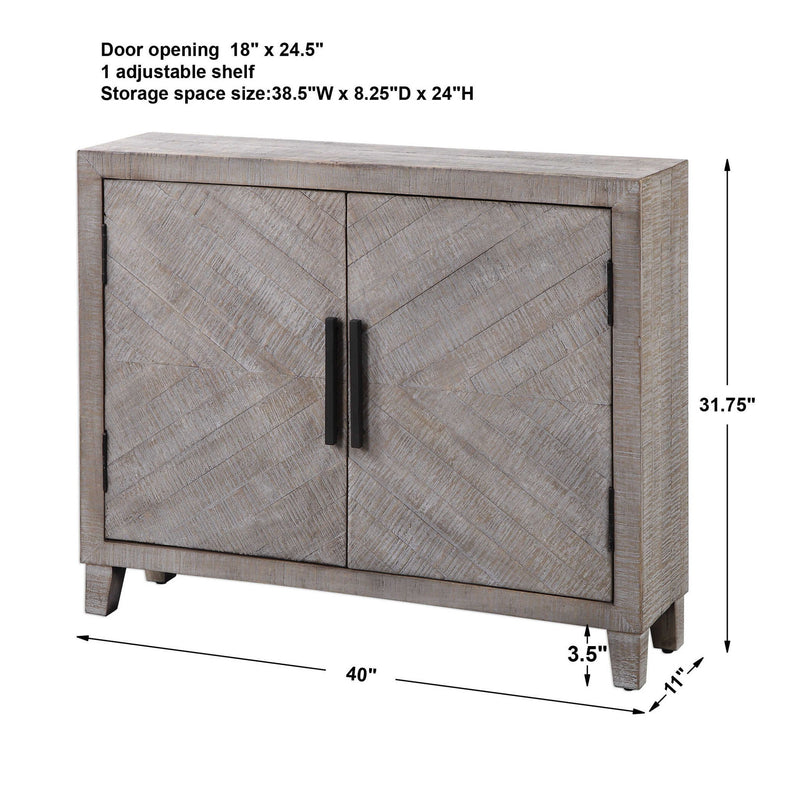 White washed Adalind accent cabinet by Uttermost with a rustic, distressed finish and classic cabinet doors.