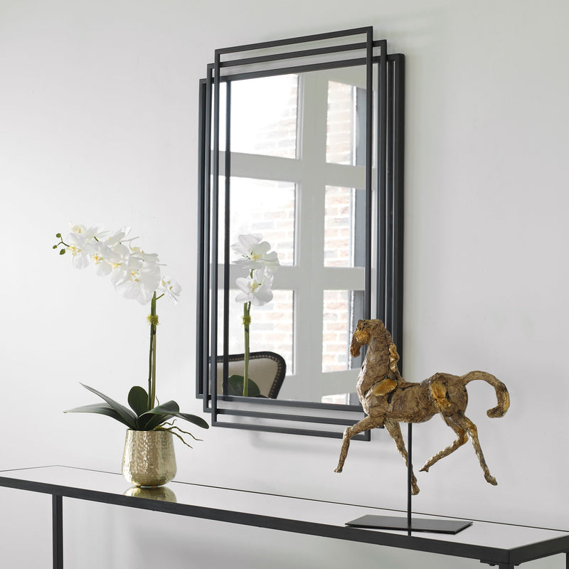 Uttermost Amherst wall mirror with a sleek, modern frame, perfect for contemporary home decor.