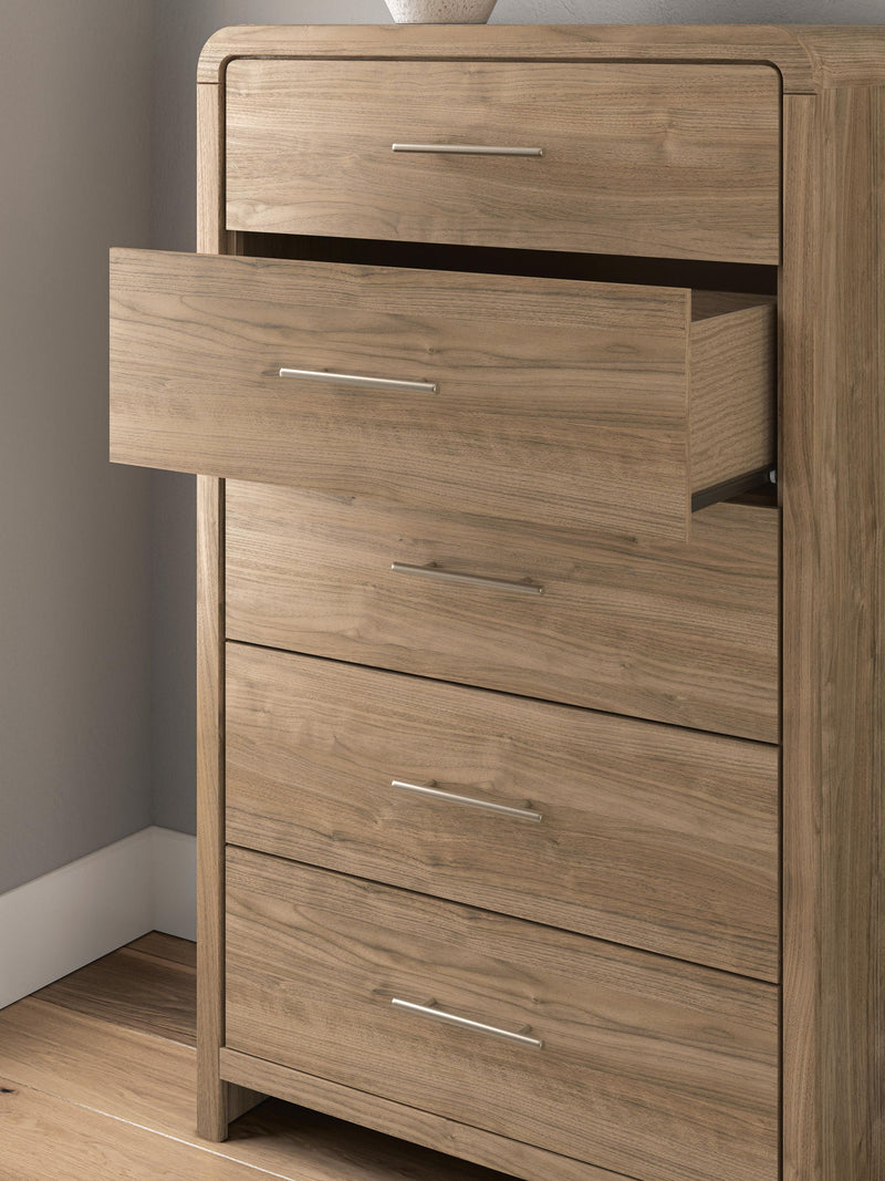 Warm natural brown five-drawer accent chest by Signature Design by Ashley® with sleek handles and modern design.