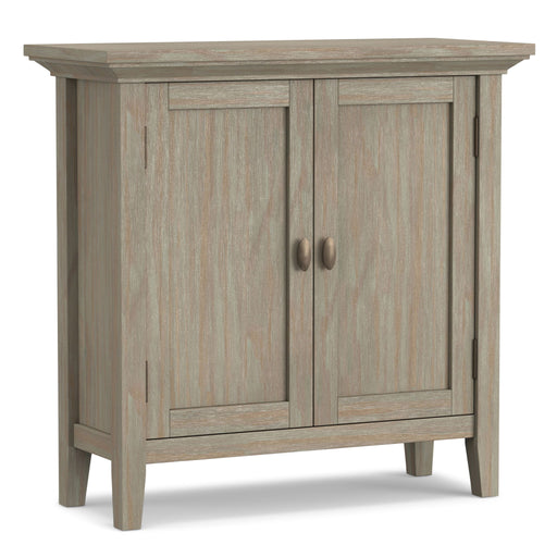 Redmond handcrafted wood accent cabinet by Simpli-Home featuring low storage and a rich red finish.