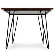 Simpli-Home Hunter handcrafted dining table with wooden surface and sturdy legs, perfect for modern dining rooms.