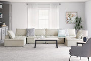 Signature Design by Ashley stationary sectional sofa with plush cushions and neutral fabric, perfect for modern living rooms.