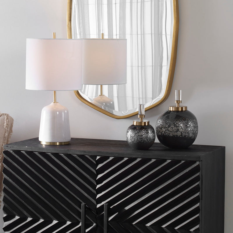 Pair of dark gray art glass bottles by Uttermost, decorative vases or jars with sleek, modern design for home décor.