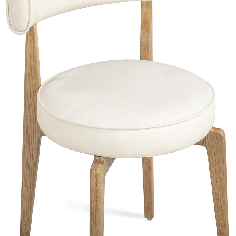 TOV Furniture Nikita dining side chair with sleek design, wooden legs, and upholstered seat for modern dining rooms