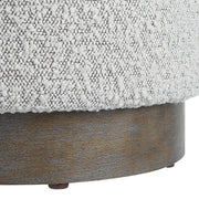 Uttermost Avila accent ottoman with plush fabric upholstery and wooden legs, versatile piece for living room or bedroom decor.