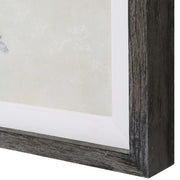 Set of three Uttermost Horizon framed prints in graphite and pearl silver on canvas, featuring modern abstract art designs.