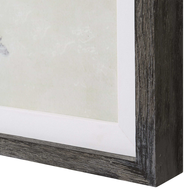 Set of three Uttermost Horizon framed prints in graphite and pearl silver on canvas, featuring modern abstract art designs.