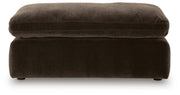Benchcraft® Maxton Heights upholstered ottoman with soft fabric and cushioned top, perfect for living room or bedroom decor.