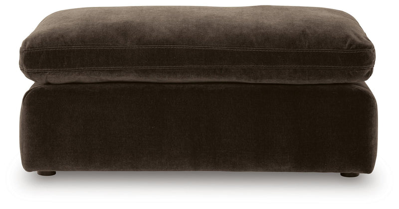 Benchcraft® Maxton Heights upholstered ottoman with soft fabric and cushioned top, perfect for living room or bedroom decor.
