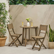 Noble House outdoor 3-piece half round folding bistro set with round table and two matching chairs on outdoor patio