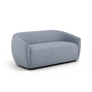 TOV Furniture Jordan stationary loveseat with plush fabric and modern design, shown in a cozy living room setting.