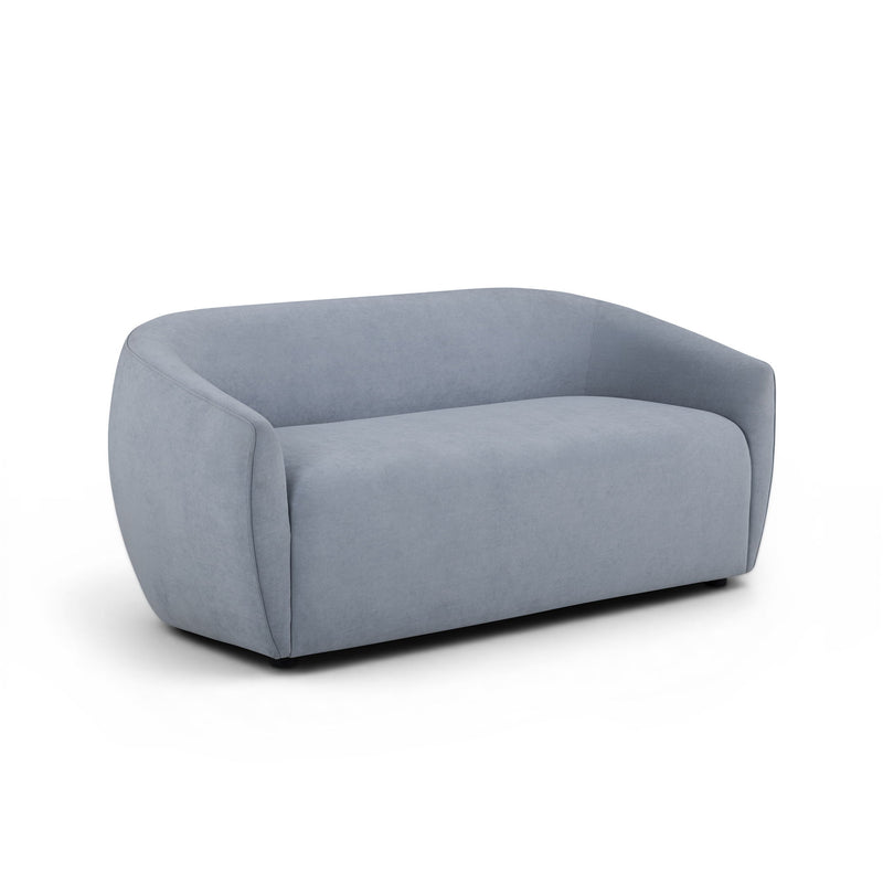 TOV Furniture Jordan stationary loveseat with plush fabric and modern design, shown in a cozy living room setting.