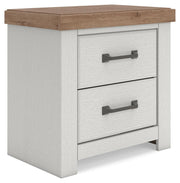 Benchcraft white and brown two-drawer nightstand with built-in charging station, modern design, and sleek finish.