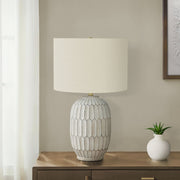 Cream transitional table lamp by 8th Street with a sleek, modern design and a fabric shade, perfect for living room or bedside.