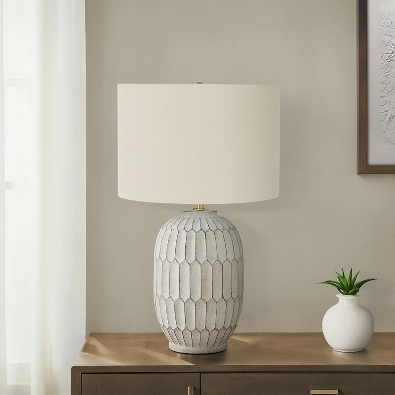 Cream transitional table lamp by 8th Street with a sleek, modern design and a fabric shade, perfect for living room or bedside.