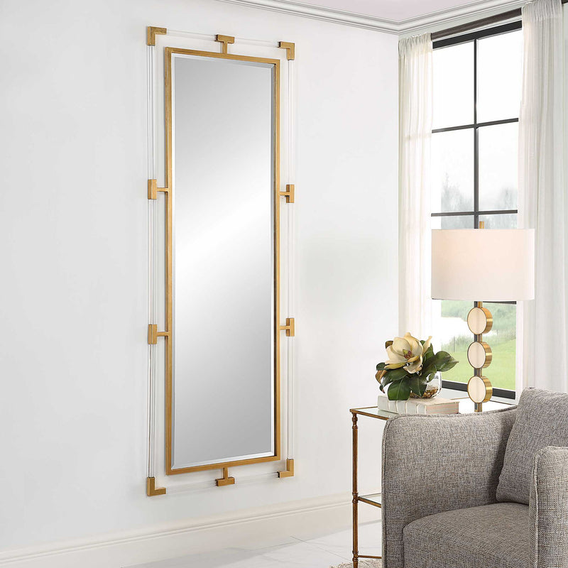 Uttermost Balkan iron wall mirror with ornate frame, decorative metal design, hanging on a neutral-colored wall.
