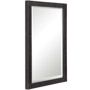 Uttermost Gower vanity mirror in aged black finish, featuring a sleek rectangular design and modern style for bedroom or dressing area.