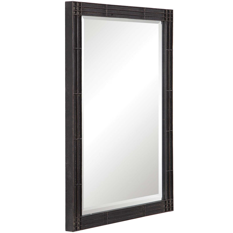 Uttermost Gower vanity mirror in aged black finish, featuring a sleek rectangular design and modern style for bedroom or dressing area.