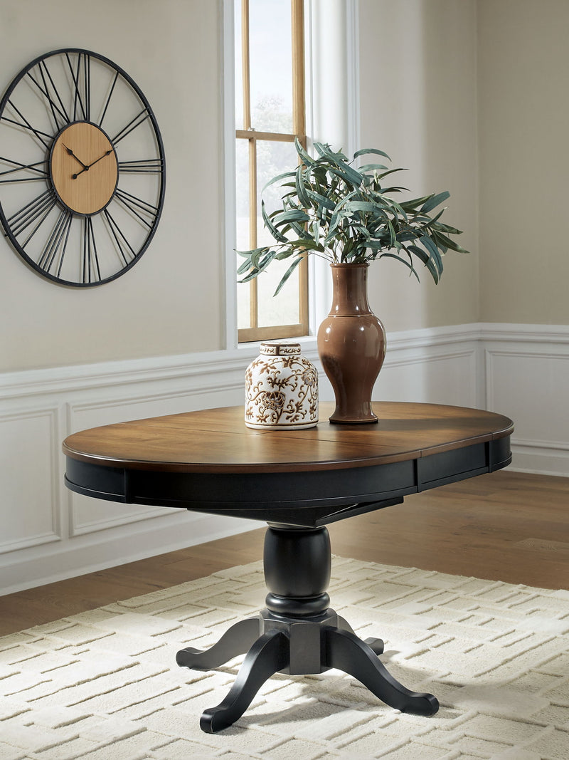 Clorazi - Oval Dining Room Butterfly Extension Table - Black / Brown - R&R Furniture Gallery (Fountain Valley, CA)