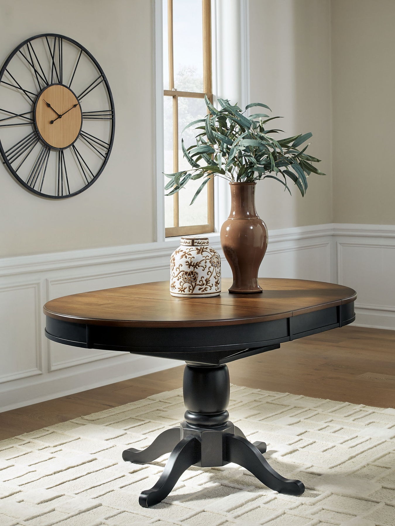 Clorazi - Oval Dining Room Butterfly Extension Table - Black / Brown - R&R Furniture Gallery (Fountain Valley, CA)