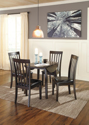 Dark brown round DRM Drop Leaf dining table by Signature Design by Ashley, featuring a smooth surface and sturdy drop leaves.