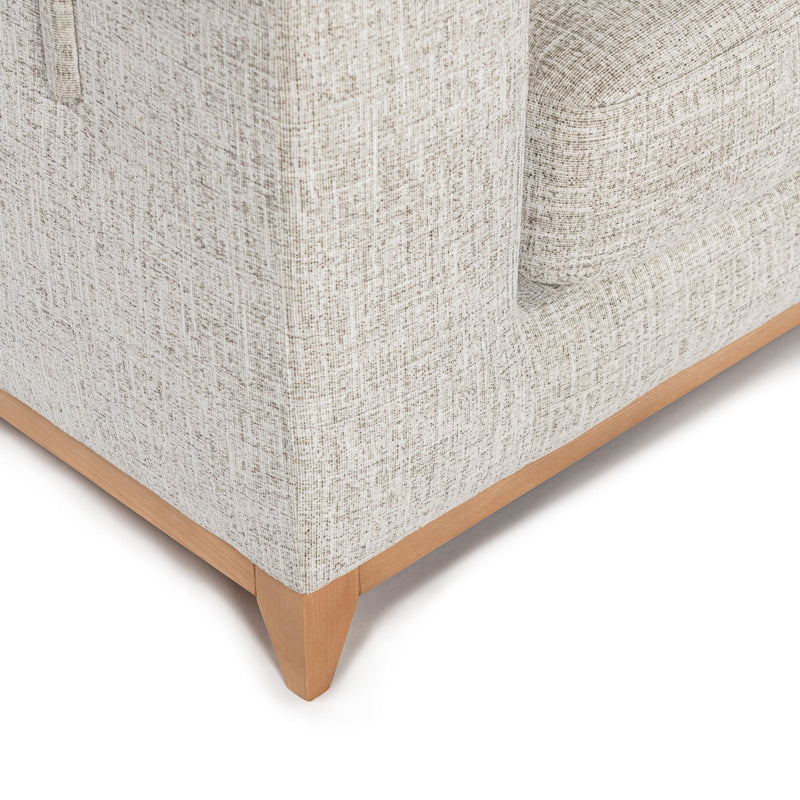 Classic Home Donovan stationary sectional sofa with plush cushions and neutral fabric, shown in a modern living room setting.
