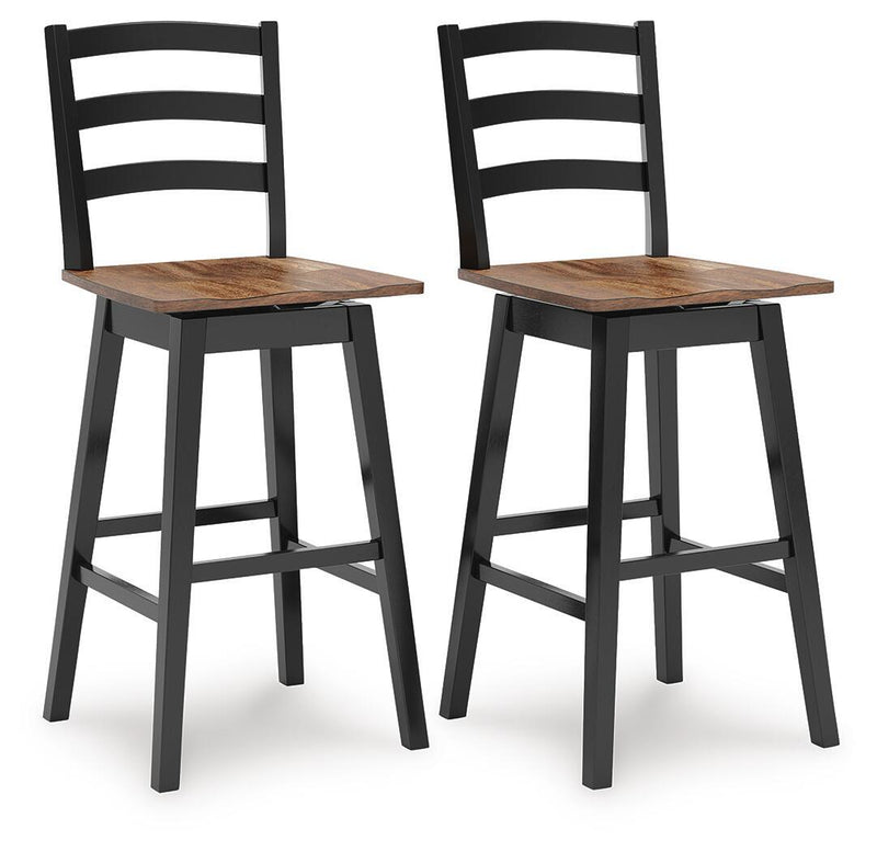 Set of two Signature Design by Ashley Wildenauer swivel stools with wooden seats and metal frames, ideal for kitchen or bar areas.