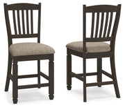 Set of two Signature Design by Ashley Tyler Creek upholstered barstools with black and grayish brown fabric, featuring padded seats and backrests.