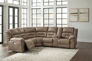 Signature Design by Ashley Ravenel 3-piece power reclining sectional with faux leather, featuring a reclining loveseat with console in fossil color.