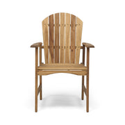 Set of two Noble House outdoor weather-resistant acacia wood Adirondack dining chairs on patio with greenery background