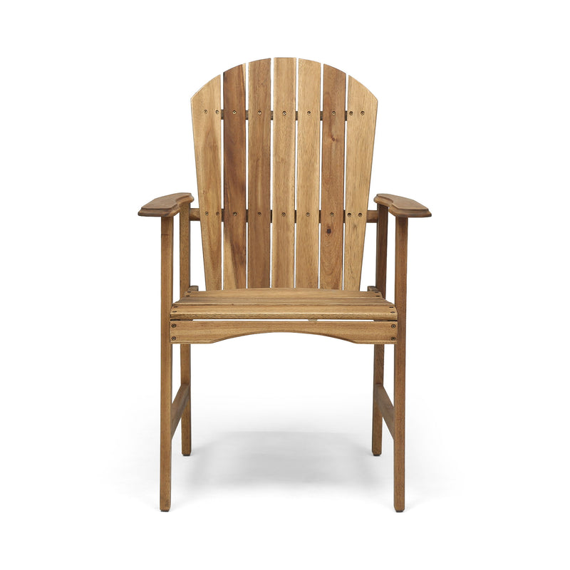 Set of two Noble House outdoor weather-resistant acacia wood Adirondack dining chairs on patio with greenery background
